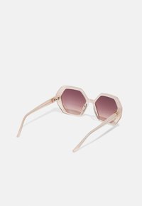 Hexagonal sunglasses with a transparent pink frame and gradient purple lenses. Features thin clear temples and gold accents on the hinges.