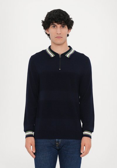 Marinekleurige pullover met ritssluiting en lange mouwen, voorzien van een gestreepte kraag en boorden in groen, blauw en wit. Glad gebreide textuur overal.