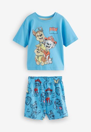 Ensemble de pyjama en coton bleu clair comprenant une chemise à manches courtes ornée de personnages de chiots en cartoon et un short coordonné avec un imprimé ludique.