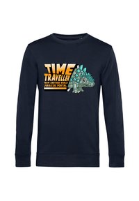 Felpa a maniche lunghe blu navy con una grafica di un dinosauro con spine. Il testo recita "VIAGGIATORE NEL TEMPO DA UN ALTRO MONDO PORTALE GIURASSICO."