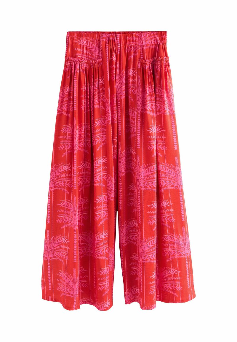 Pantalones culottes ligeros rojos con cintura elástica, que presentan un patrón botánico en rosa. Diseño fluido con piernas anchas y textura sutil.