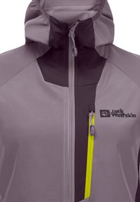 Lightweight, purple jacket with a high collar, contrasting dark accents, prominent zippers, and logo detail. Features a bright yellow zipper.