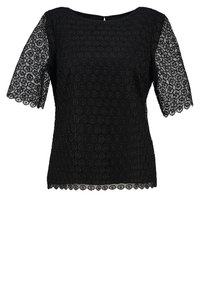 Haut en dentelle noire à manches courtes, doté de motifs circulaires et de bords festonnés. Encolure ronde simple avec une fermeture au dos en forme de trou de serrure.