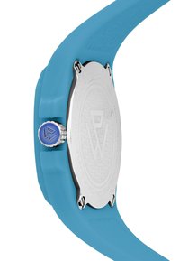 Correa de reloj de silicona azul con caja de acero inoxidable plateada. Presenta un patrón texturizado en la correa y una corona morada con un logo grabado.
