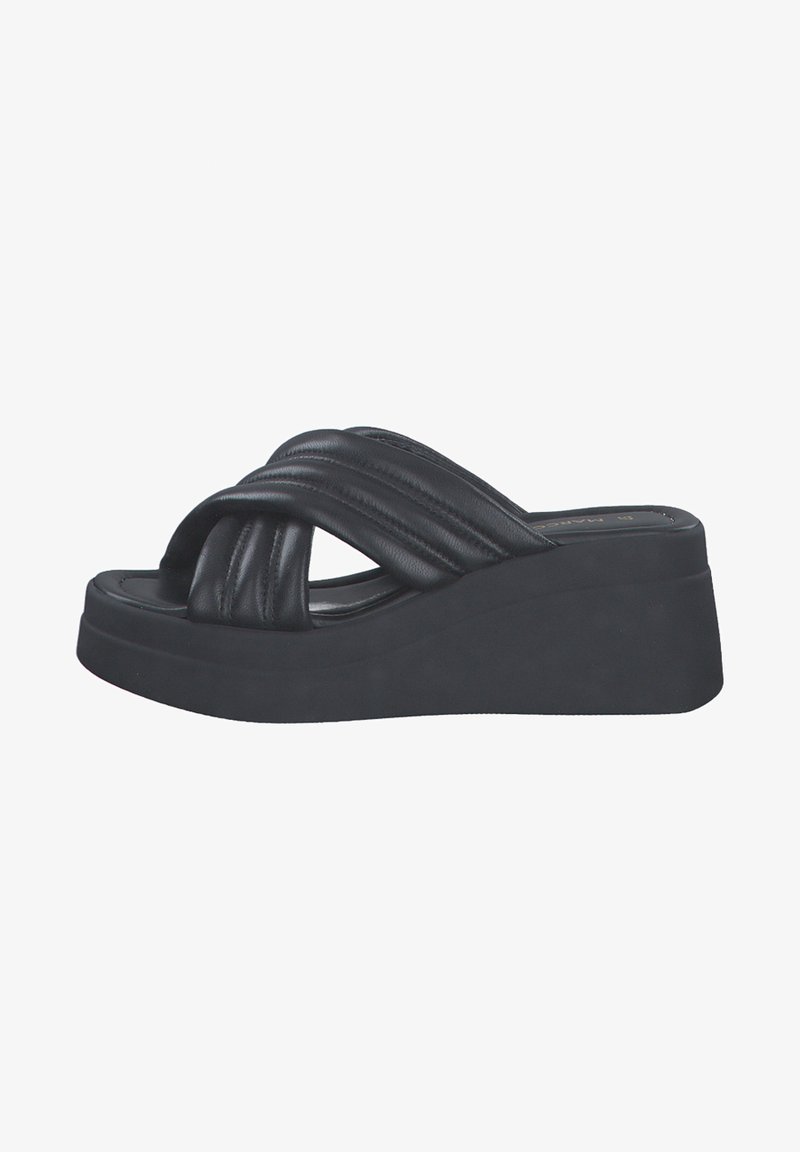 Black wedge sandals made of synthetic leather with a quilted strap design, featuring a textured platform sole and open toe.