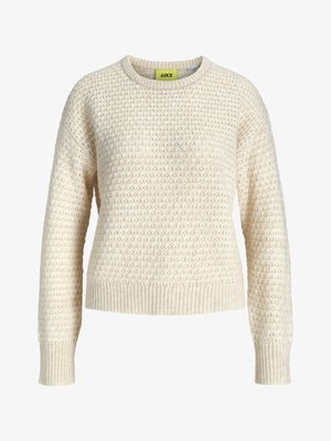 Light beige knitted sweater with a textured pattern, round neck, and ribbed cuffs and hem. Label displays bright yellow text.