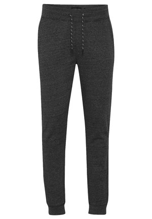 Tmavě šedé teplákové kalhoty vyrobené z měkké tkaniny, s elastickým pasem na šňůrku a zúženými manžetami na kotnících pro přiléhavý vzhled.