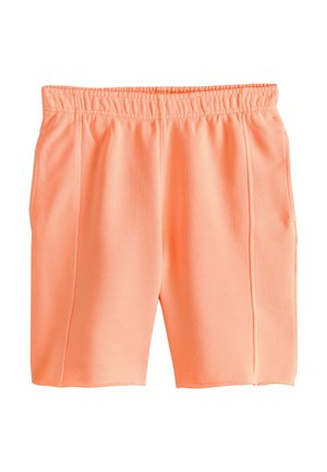 Miękkie szorty w kolorze brzoskwiniowym z elastycznym pasem i detalami wzdłuż bocznego szwu, odpowiednie do codziennego noszenia.