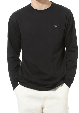 Black long-sleeve shirt made of cotton. Features a round neck and a small Vans logo on the chest. Smooth texture, relaxed fit.