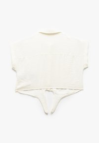 Top corto a maniche corte in bianco sporco, con superficie testurizzata, colletto e un design unico sul retro con un'apertura e dettagli di cravatta.