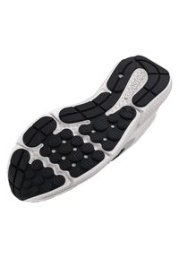 Suela de zapato con una base blanca y una banda de rodadura de goma negra, que presenta patrones circulares elevados y texturizados para proporcionar tracción y agarre.
