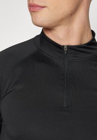 YOURTURN MUSCLE FIT LONG SLEEVE WITH ZIP UNISEX - Hosszú ujjú felső - black