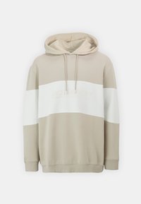 Beige Kapuzenpullover mit strukturierter Oberfläche und einem weißen horizontalen Streifen über der Brust, der ein subtil eingearbeitetes Logo in passender Farbe trägt.