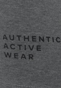 Gray cotton fabric with a ribbed texture featuring black print that reads "AUTHENTIC ACTIVE WEAR." Simple, understated design.