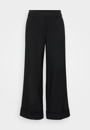 Sorte vide bukser laget av glatt stoff, med flat front, to sidelommer og oppbrettede sømmer for ekstra detaljer.