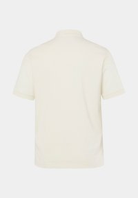 Kortærmet polo shirt i off-white bomuldsblanding, med standard krave og ren, minimalistisk syning langs ærmerne og kanten.