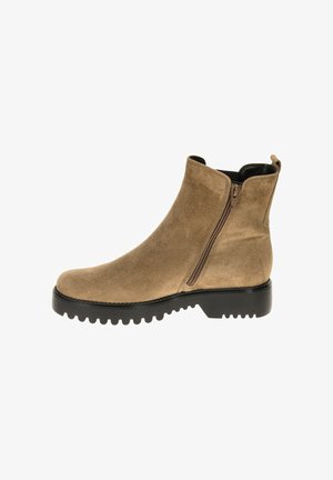 Beige suede ankle boot with side zipper, a round toe, and a rugged black rubber sole featuring deeper treads for traction.