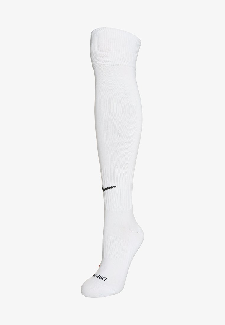 Meias atléticas brancas até ao joelho, feitas de um tecido liso e elástico. Apresentam o logótipo preto da Nike perto do topo e a bainha canelada.