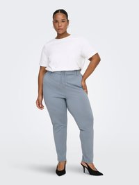 Light grey trousers with a drawstring waist, paired with a plain white short-sleeve top and black heeled shoes. Smooth fabric texture.