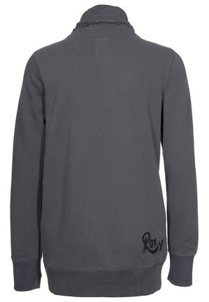 Sweat-shirt gris foncé à manches longues avec col haut, coutures visibles et logo "Roxy" près de l'ourlet bas arrière sur le côté droit.