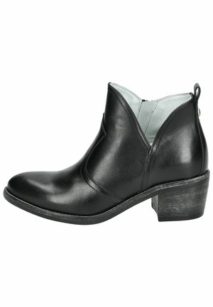 Black leather ankle boot with a pointed toe, V-shaped cut sides, and a stacked heel. Interior features light blue lining, adding contrast.