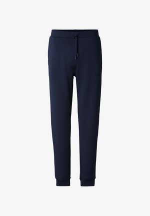 Peenvärvi tumel sinised dressipüksid, valmistatud pehmest kangast, millel on nööriga vöökoht, kitsenevad säärised ja soonikkäänikud. Külje peal on peen logo detail.