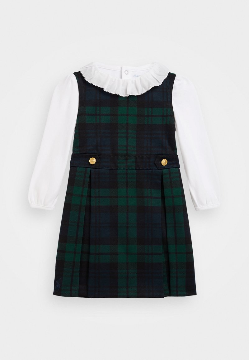 Karirana obleka z zeleno in črno vzorcem, z nabranim belim ovratnikom, dolgimi rokavi in zlatimi gumbi. Oblika nabranega krila.