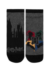 Gray cotton socks featuring a Hogwarts castle silhouette on one side and a colored emblem with house icons on the other. Black trim at top.