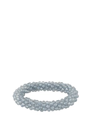 Light blue faceted bead bracelet coiled in a circular shape on a white background.