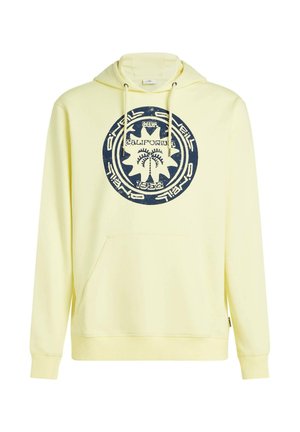 Dzeltena kapuce ar lielu tumši zilu apaļu logotipu ar palmām, kapuces auklu, kangaru stila kabatu, ribotām aprocēm un mīkstu auduma tekstūru.