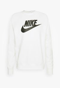 Felpa bianca realizzata in un tessuto dalla consistenza morbida, con un grande logo nero "NIKE" e un design a swoosh curvo sul davanti.