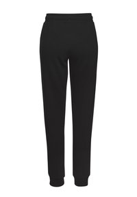 Schwarze Jogginghose mit elastischem Bund, schmal zulaufenden Beinen und gerippten Bündchen. Hergestellt aus weichem Stoff, ausgelegt für Komfort und Bewegungsfreiheit.