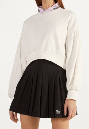 Falda acampanada - black