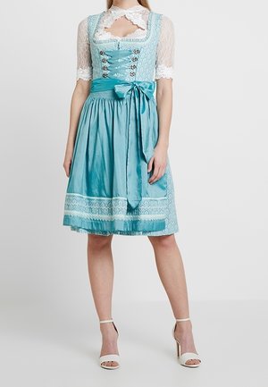 Vaaleansininen dirndl-mekko, jossa on pitsinen yläosa ja lyhyet hihat, satiinivyötärö ja rusetti, polvipituinen helma kuvioidulla reunuksella.