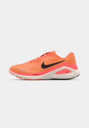 Nike running shoe in neon orange with black logo, lightweight mesh upper, cushioned midsole, and textured rubber outsole for traction.