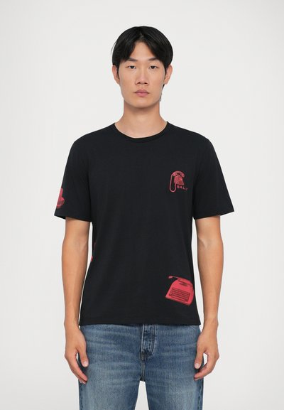 Black cotton t-shirt with short sleeves, featuring red graphic designs of a telephone and a typewriter on the chest and side.