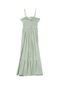Maxi dress in light green, featuring a smocked bodice, adjustable straps, and a flared skirt with a ruffled hem. Soft fabric texture.