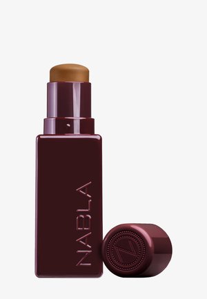 Burgundy cylindrical lipstick tube with a gold twist-up top, featuring embossed brand name "NABLA" and circular embossed logo on cap.
