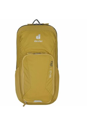 Sac à dos jaune avec une texture douce, comprenant un compartiment principal et une poche avant, des fermetures éclair et un logo à l'avant.