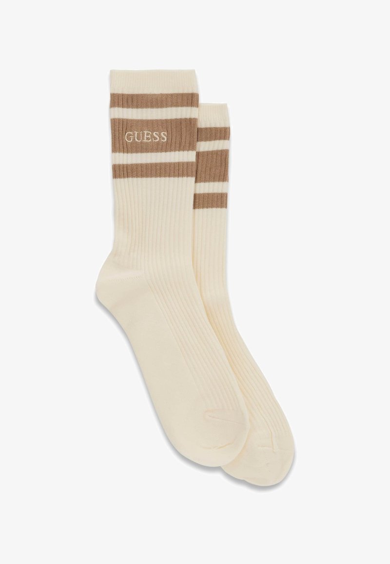 Pair of ribbed cream socks with brown horizontal stripes and "GUESS" logo embroidered near the top cuff.