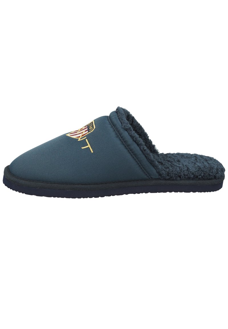 Navy blue slipper with a soft, textured interior and a smooth exterior. Features an embroidered logo on the upper and a thick sole.