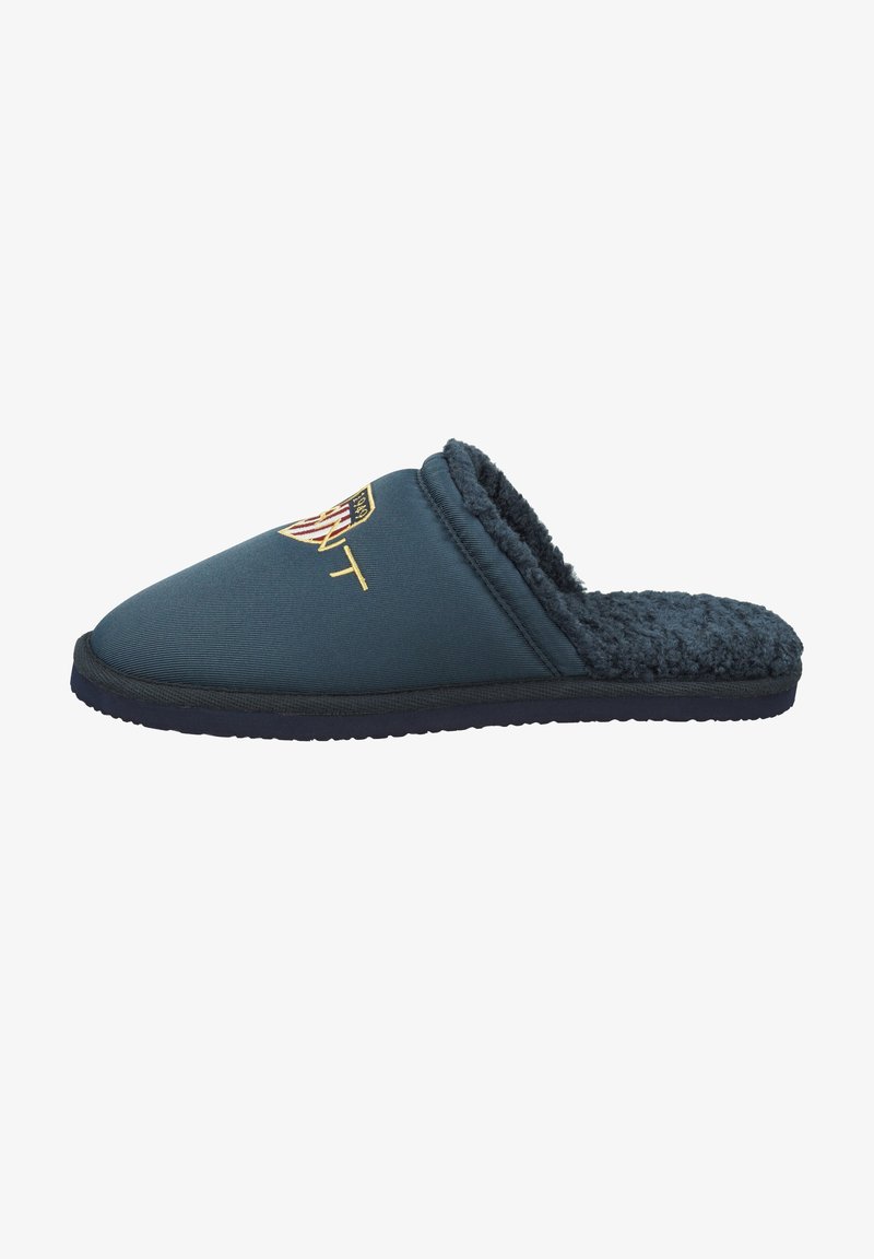 Navy blue slipper with a soft, textured interior and a smooth exterior. Features an embroidered logo on the upper and a thick sole.