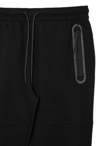 Schwarze Jogginghose aus weichem Material, mit einem elastischen Taillenbund und Kordelzug sowie einer Reißverschlusstasche mit grauem Akzent.