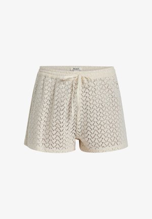 Dzianinowe szorty w kolorze kremowym z teksturowanym, otwartym splotem. Posiadają elastyczny pas i regulowany sznurek, co zapewnia luźny krój.