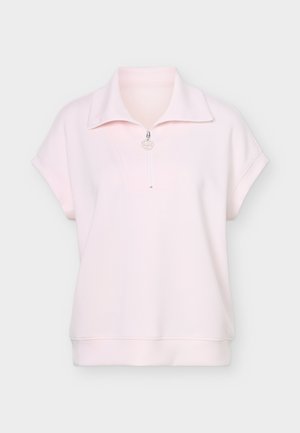 Light pink short-sleeve pullover with wide collar and half-zipper front, made of soft fabric with folded sleeve cuffs.