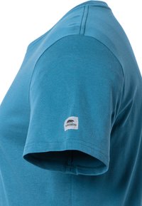 Teal t-shirt met korte mouwen, gemaakt van zachte stof, met een ronde halslijn en een klein "Forsberg" logo label op de mouw.
