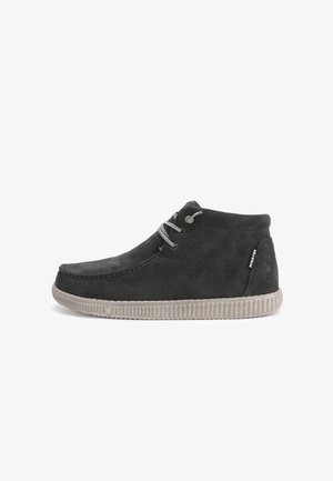 Grey suede ankle boots with rounded toe, grey laces, and a textured, light grey rubber sole featuring a ridged pattern.