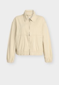 Chaqueta beige corta en una suave mezcla de algodón, con puños y cintura elásticos, cierre frontal de cremallera y bolsillos laterales. Diseño simple y limpio.