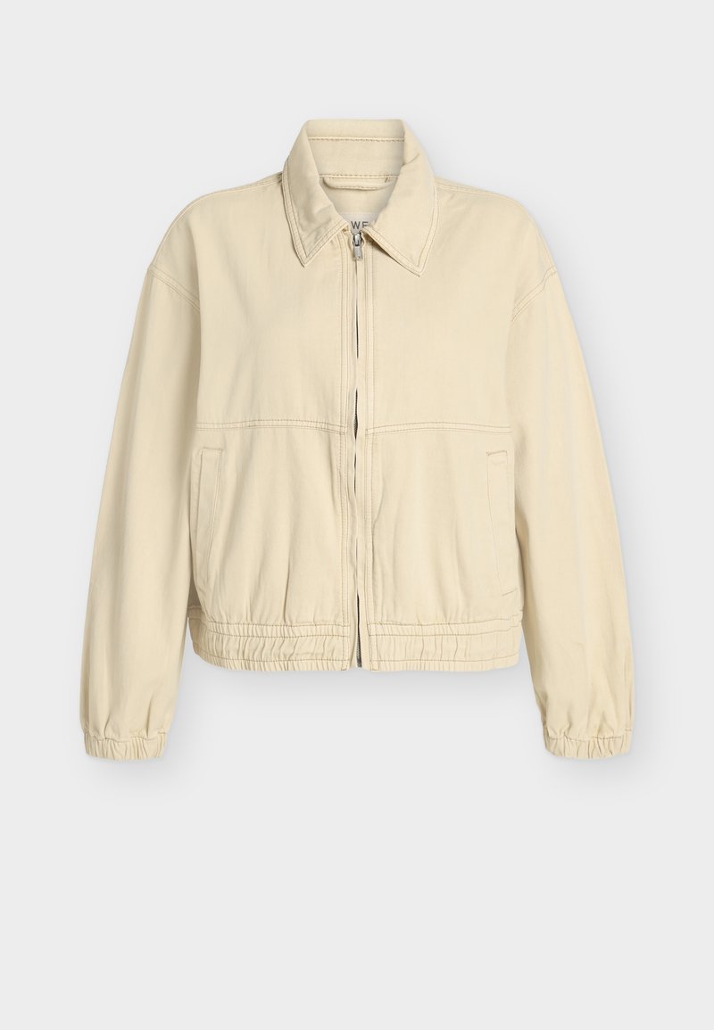 Chaqueta beige corta en una suave mezcla de algodón, con puños y cintura elásticos, cierre frontal de cremallera y bolsillos laterales. Diseño simple y limpio.