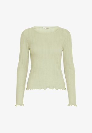 Šviesiai žalia ilgomis rankovėmis viršutinė dalis, su briaunota tekstūra, banguota apatine dalimi ir apvaliu iškirpimu. Lygus audinys su prigludusia siluetu.